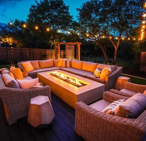 Privacy screen lit at night around a Bee Cave backyard deck