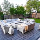 Cedar slat privacy screens rising above a wood fence beside a composite deck and fire table in a Bee Cave backyard