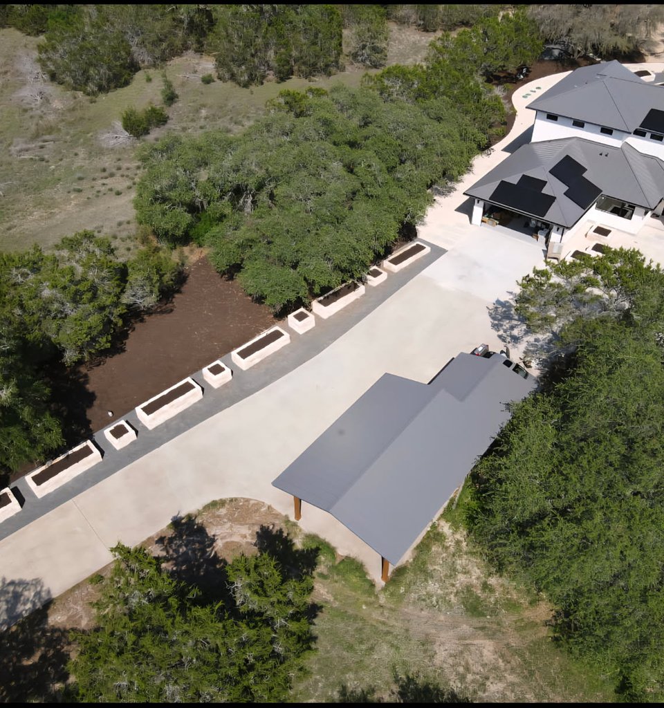 Aerial view of a Driftwood garden estate driveway and entrance