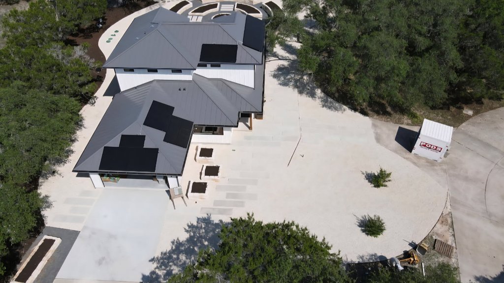 Aerial view of a Driftwood garden estate master plan with raised beds laid out around the home