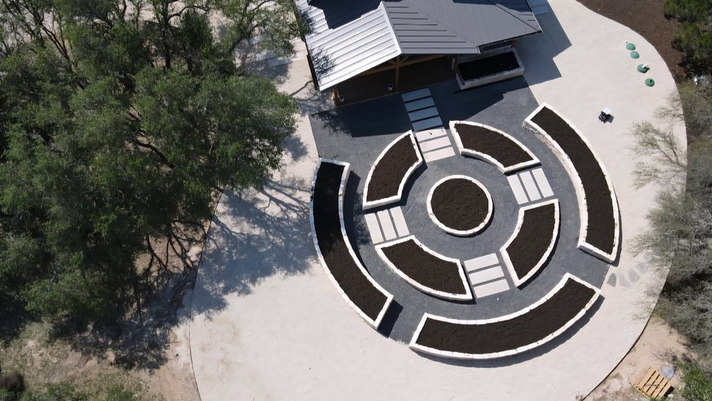 Aerial concept view of a multi-acre Driftwood property with raised beds and paver zones