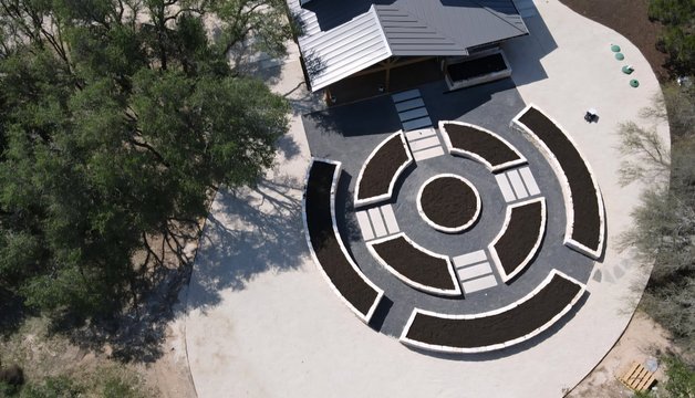 Aerial view of paver paths between raised beds at a Driftwood garden estate near Austin