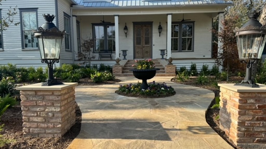 Flagstone walkway with brick columns and urns approved through design and review