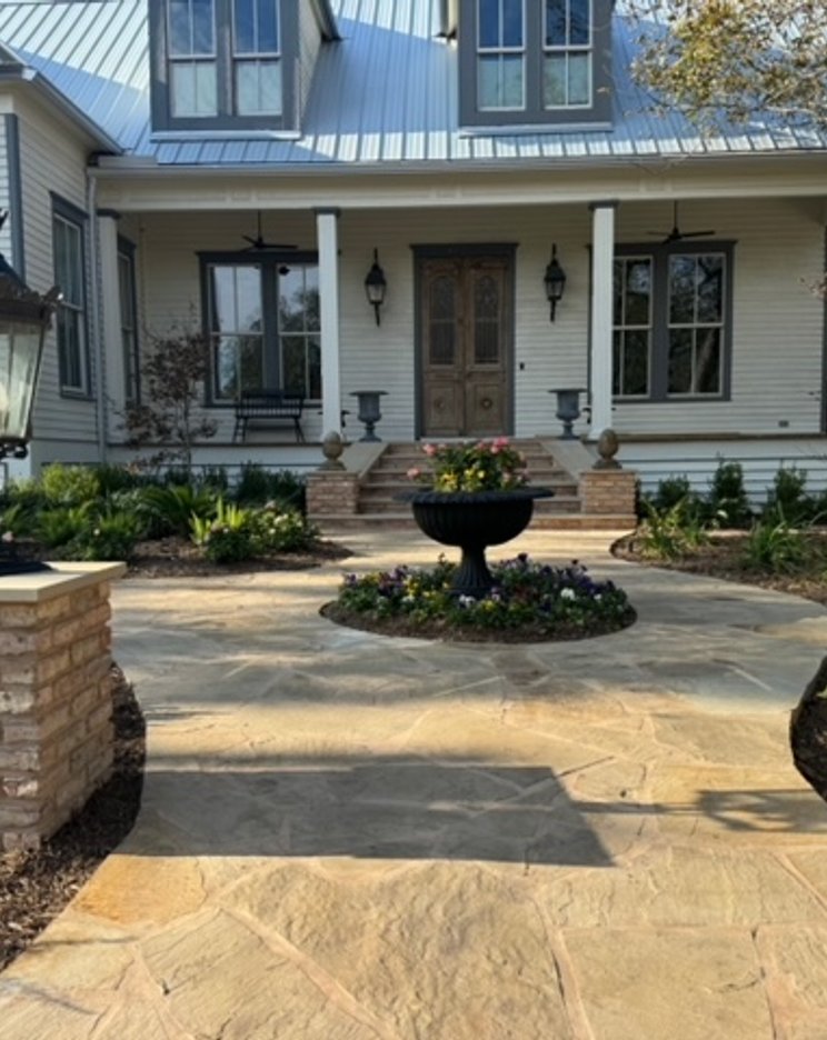 Flagstone walkway with brick columns and urns on a Fayetteville grade change