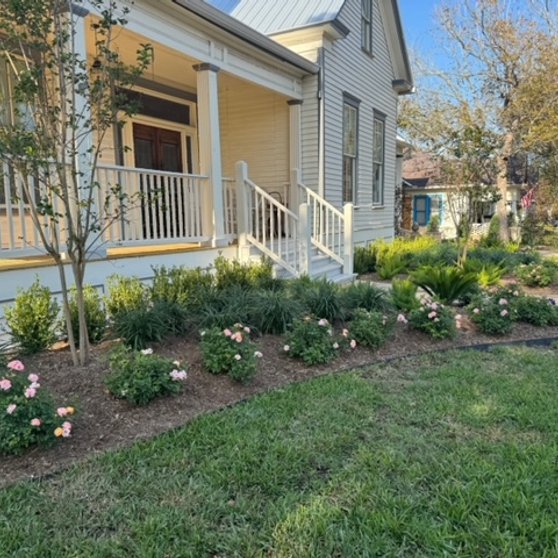Full, healthy flower beds and lawn at a renovated Fayetteville-area landscape