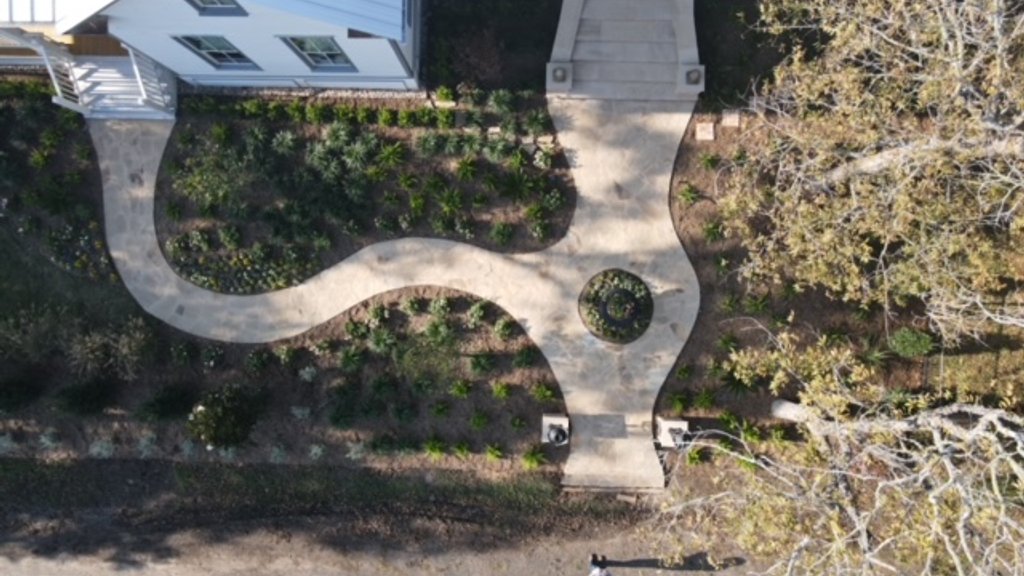 Aerial site analysis of a property with flagstone walkway and garden beds