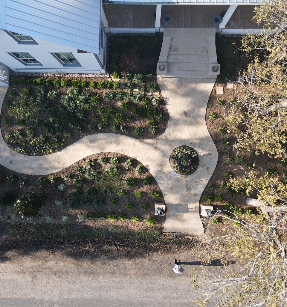Fayetteville garden district style landscape with flagstone walkway and layered beds