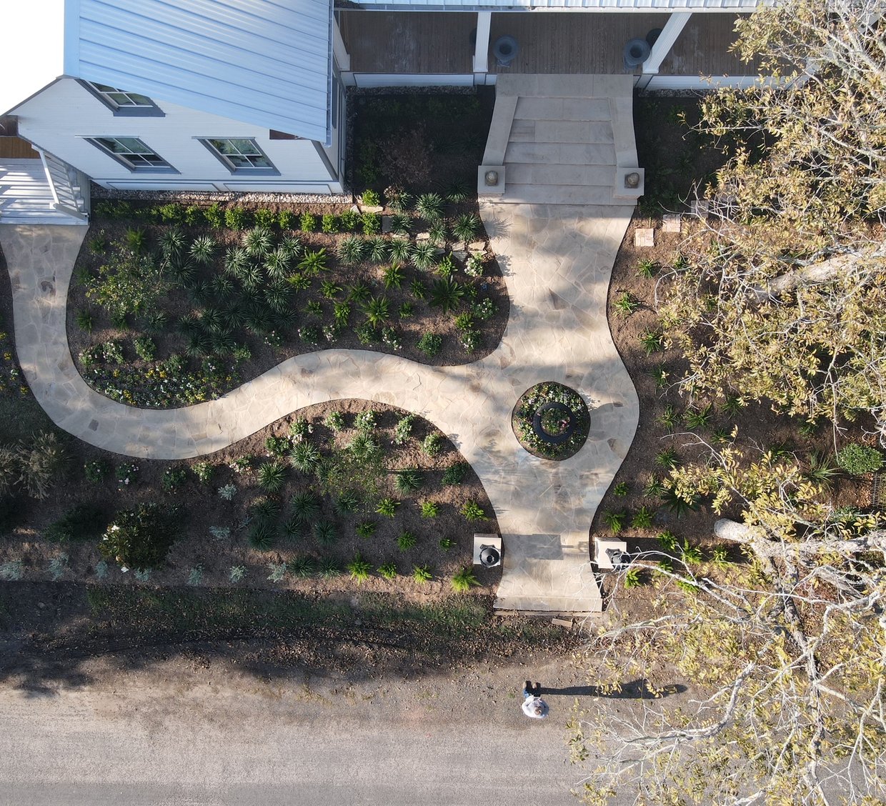 Fayetteville garden district style landscape with flagstone walkway and layered beds
