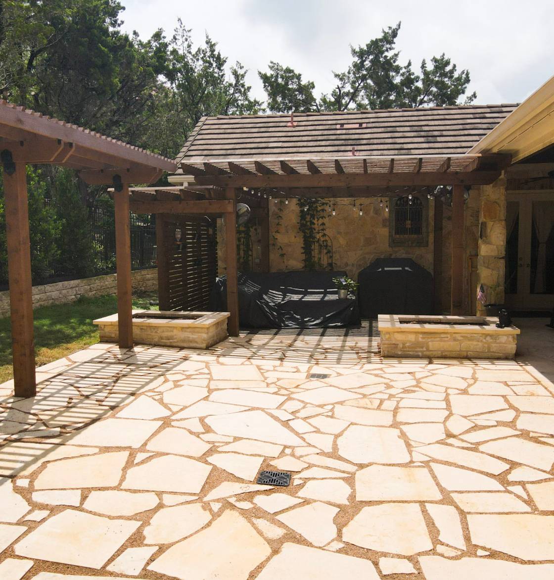 Lakeway home with stone walkway, native plantings, and landscape lighting