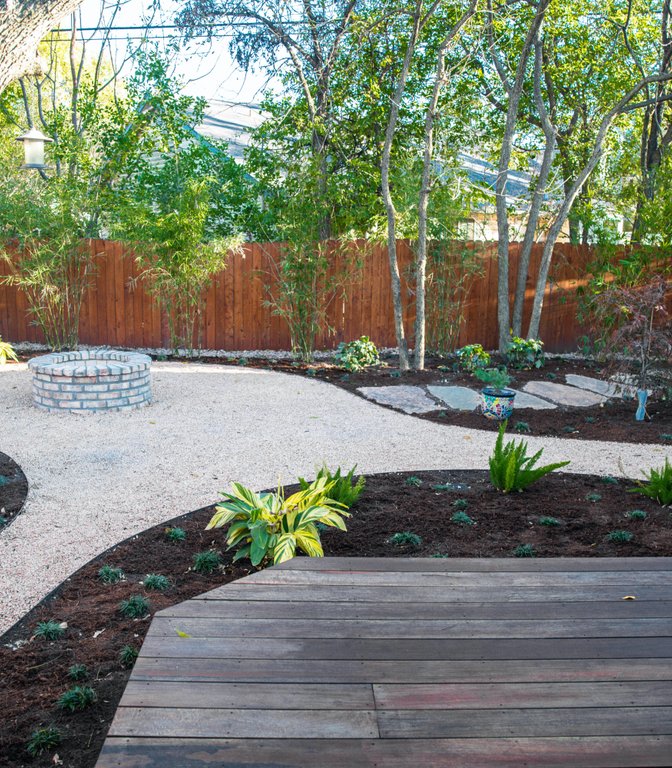 Full shaded planting beds and decomposed granite at a Riverplace garden escape