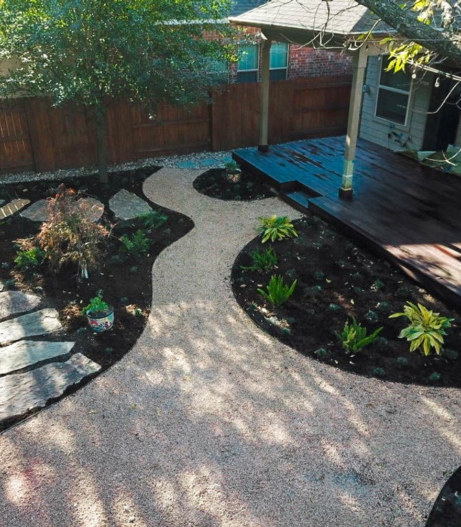New flagstone pathway with decomposed granite and planting beds built at a Riverplace home