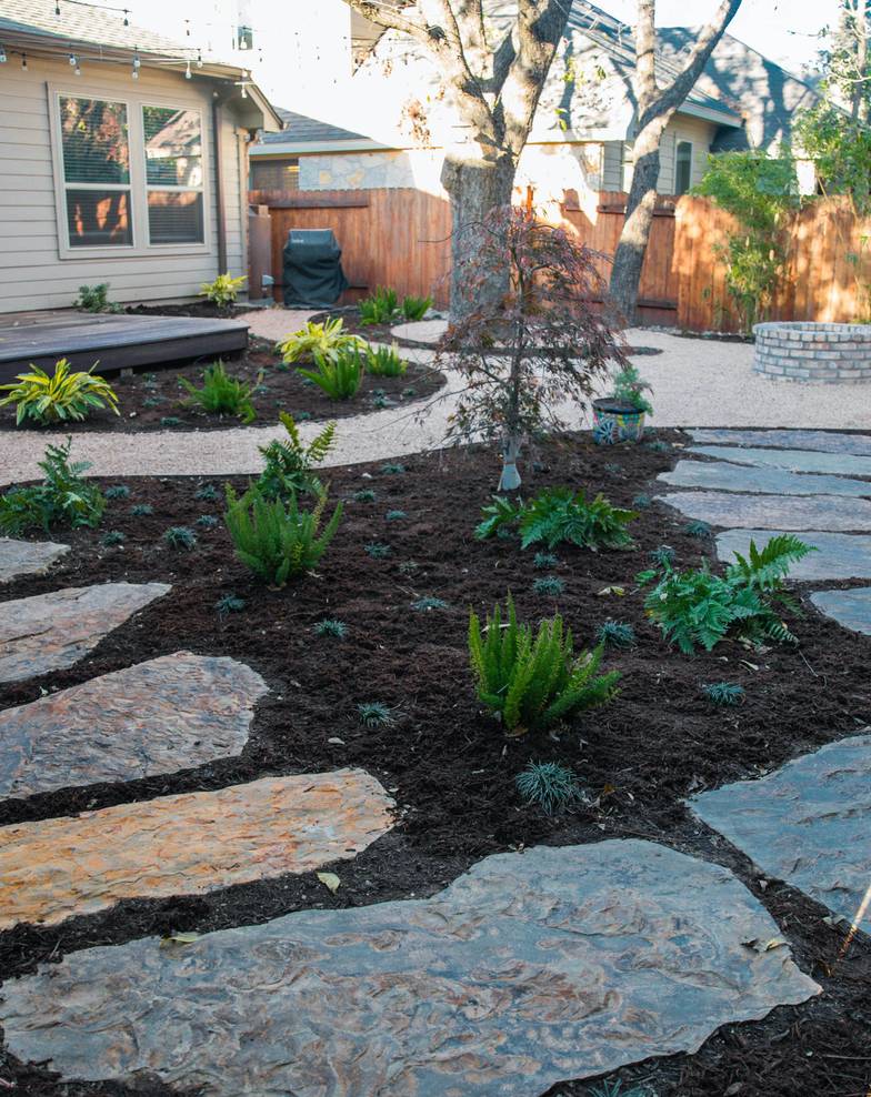 River Place front yard with stone path and landscape lighting