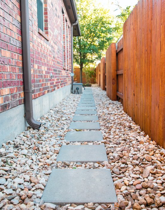 River Place home entry with native plants and walkway lighting