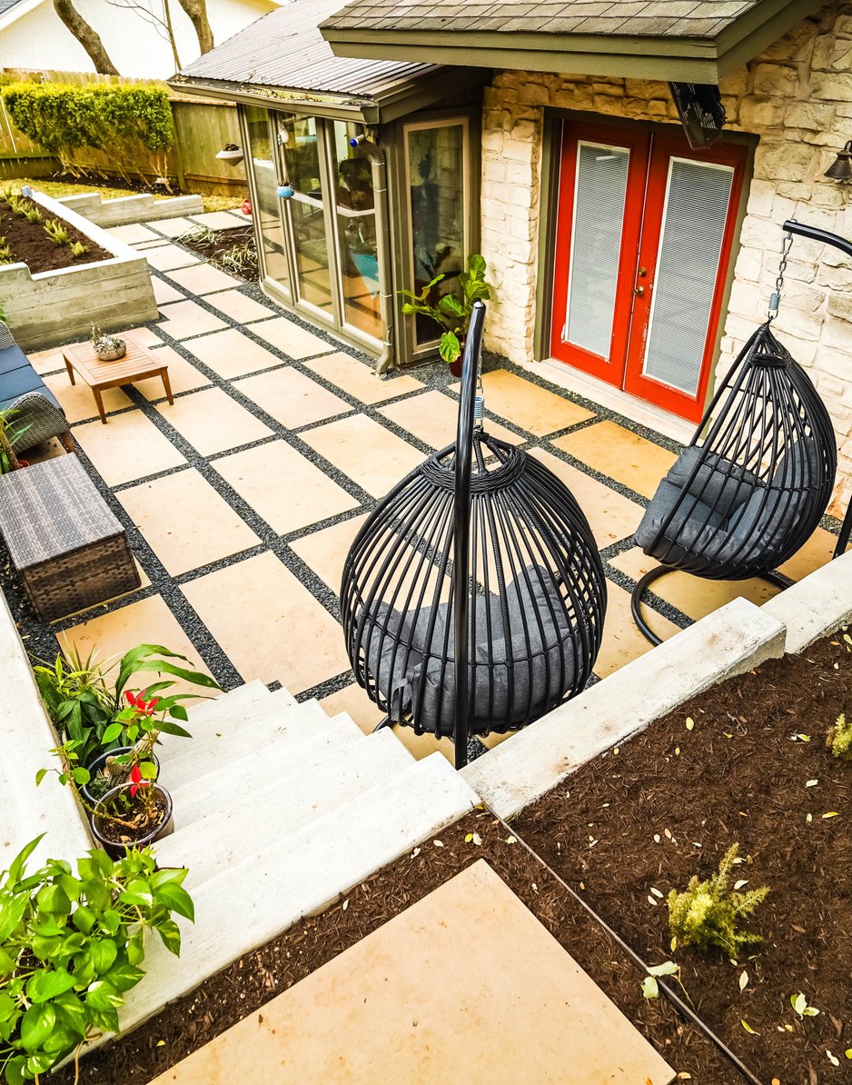 Paver patio and raised planting beds along the concrete terrace