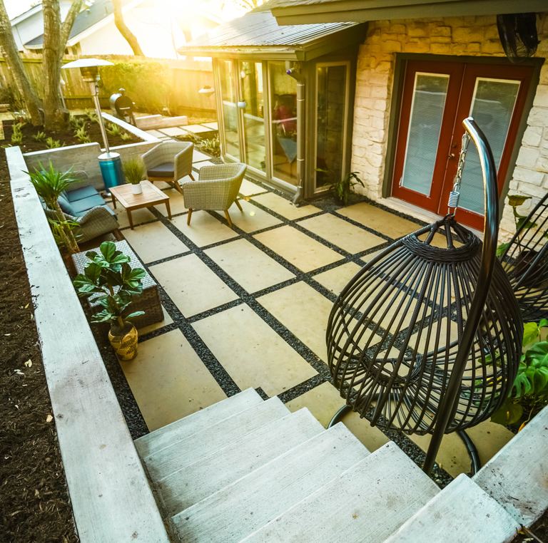 Stone patio and retaining wall hardscape installation in Austin