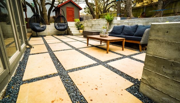 Flagstone steps and pathway connecting terraced levels in an Austin yard