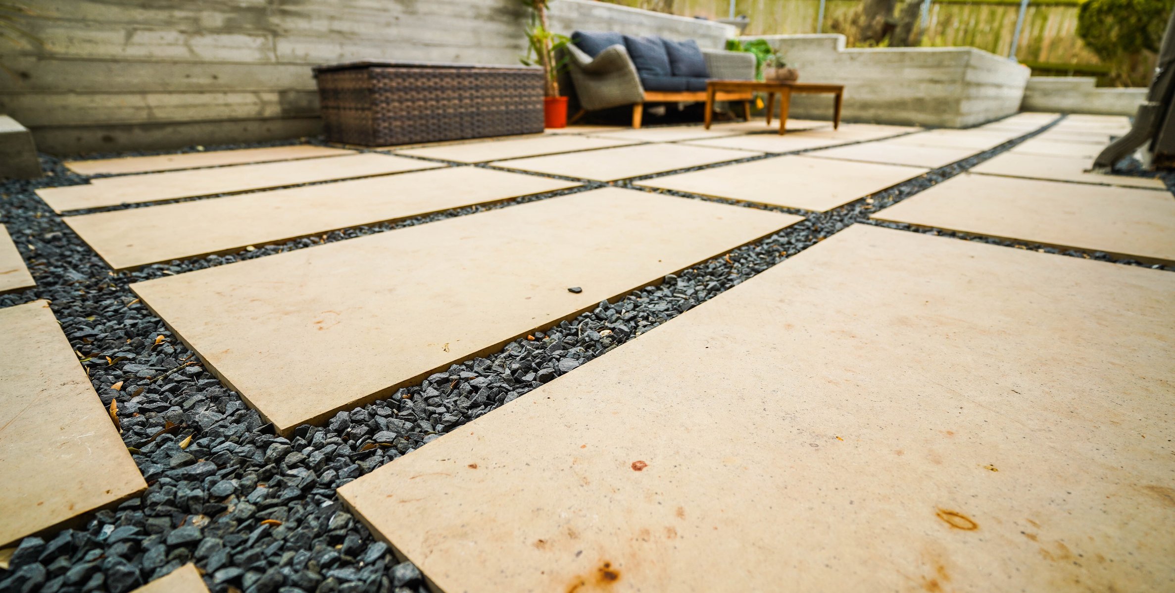 Refined paver surface with gravel joints set into the terraced concrete framework