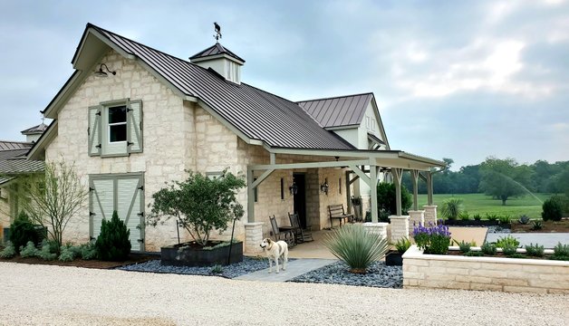 Planted driveway beds with native plants at a Smithville-area home