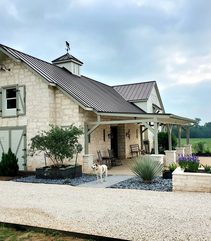 Finished custom home with thoughtful driveway and planter bed placement