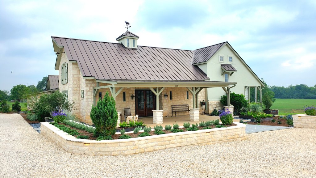 Smithville home with stone retaining walls and planter beds audited for security lighting