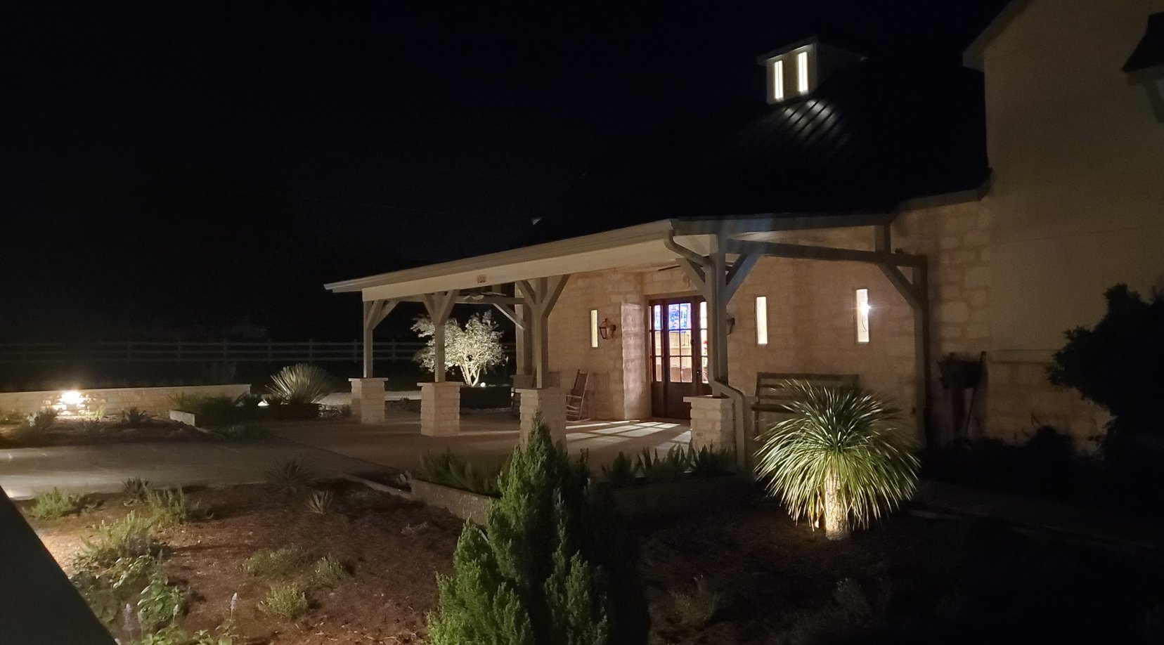 Covered pavilion with landscape lighting and xeriscape plantings