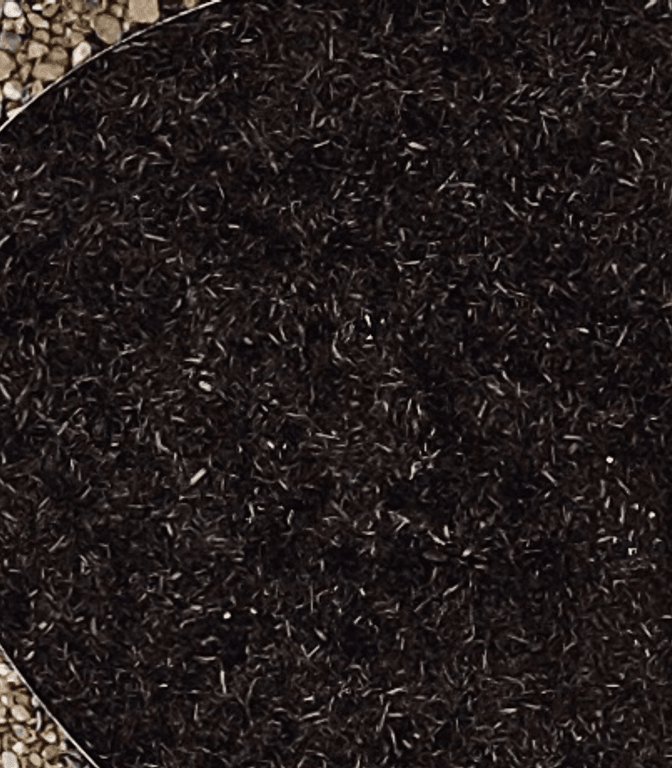 Spicewood front yard with gravel and mulch beds over a graded, well-drained surface
