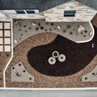 Aerial view of an Austin xeriscape with gravel, mulch beds, ornamental grasses, and paver walkways