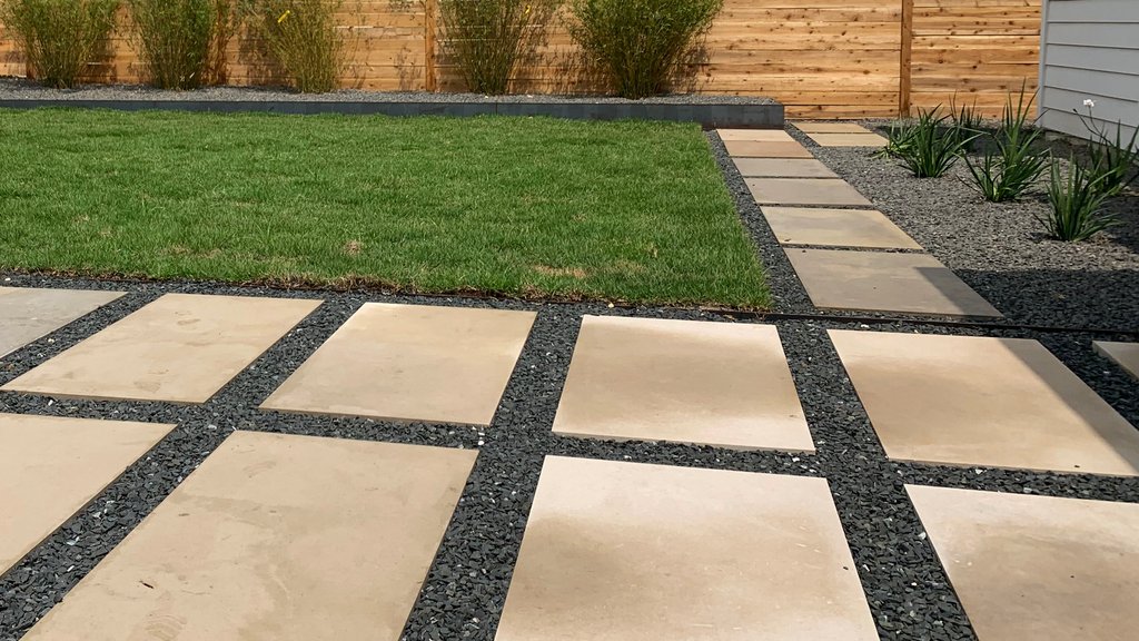 Westlake Hills terrace with separate sod, gravel, and planting-bed zones