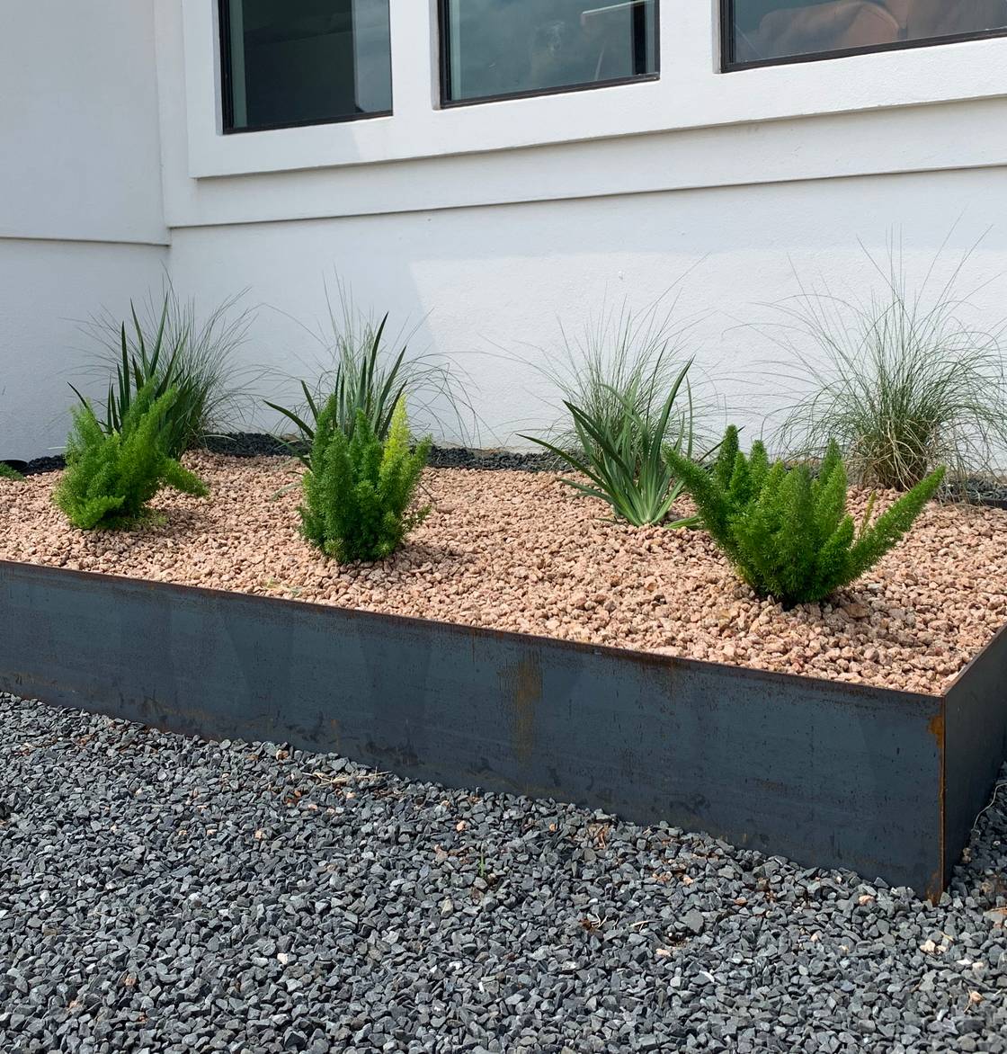 Westlake Hills estate with stone walkway, native plantings, and landscape lighting