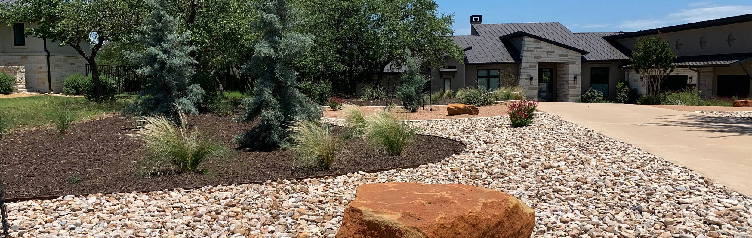 Dripping Springs, TX hill country estate with landscape installation by Thrive Landscape and Design