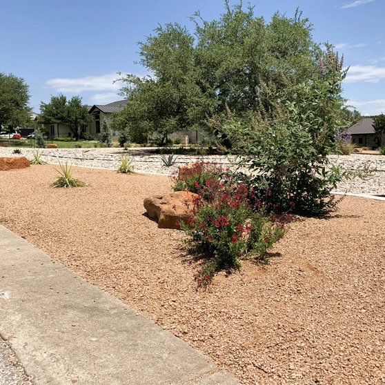 Hill Country property in Dripping Springs with native plantings and crushed granite