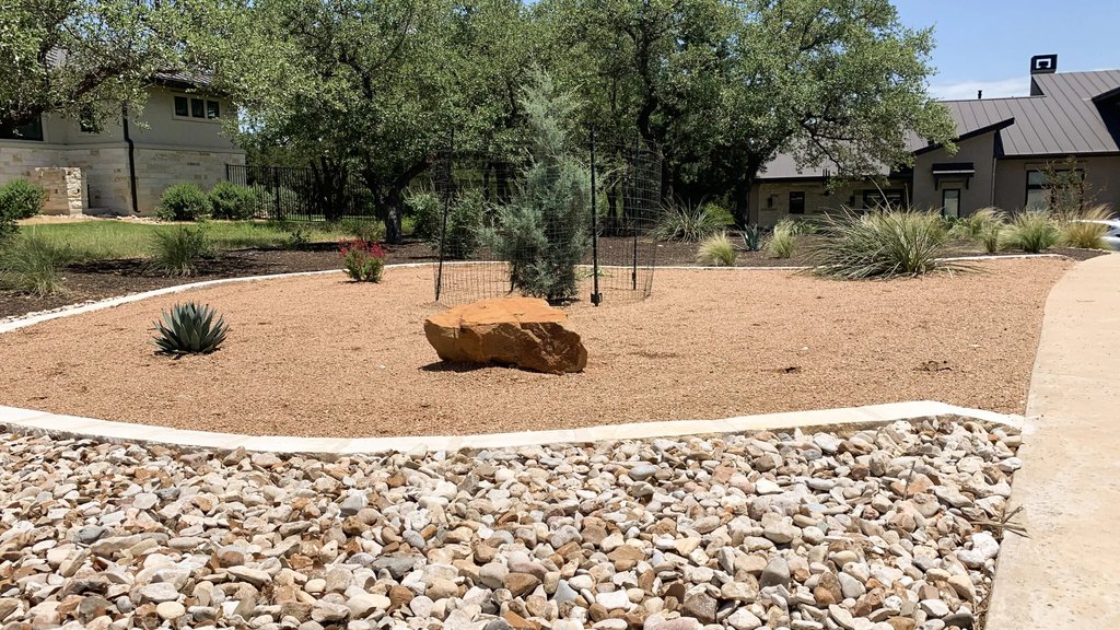 Bed preparation and tree planting for a native install in Dripping Springs